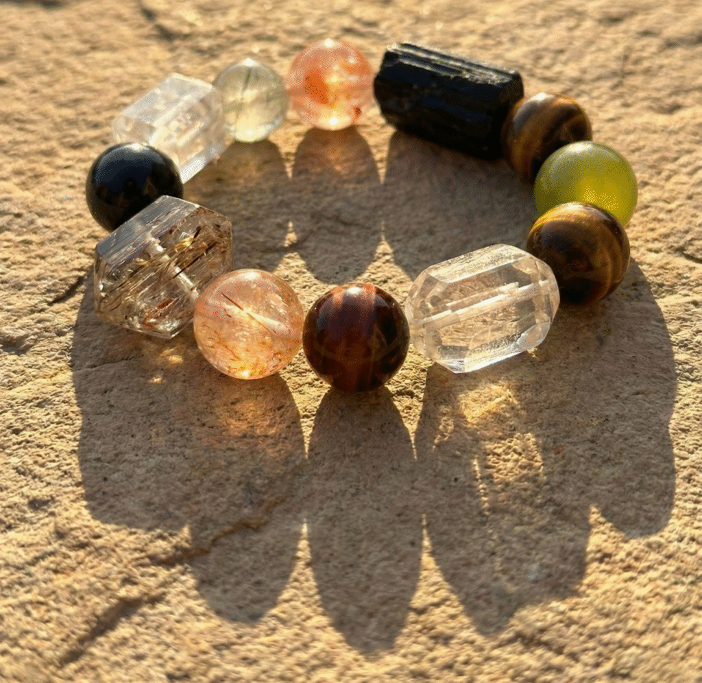 A natural crystal bracelet glowing in the sunlight, representing the connection between earth's energy and daily life.